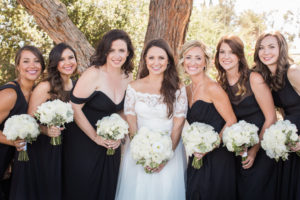 wedding at Sogno del Fiore winery in Santa Ynez, bridal party photo with mismatched black bridesmaid dresses and white flower bouquets