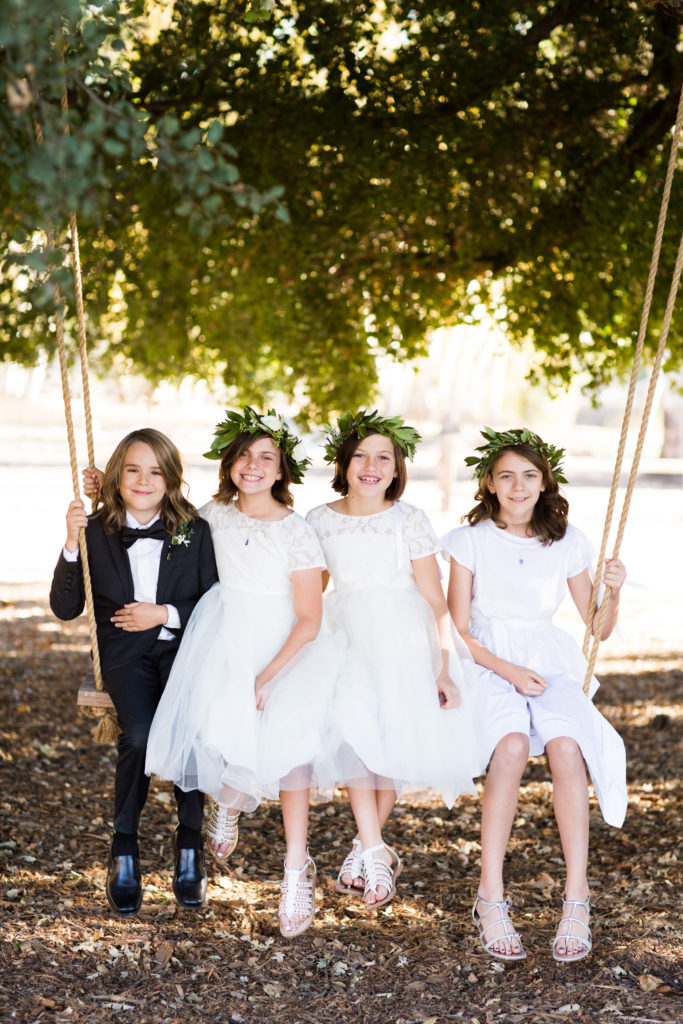 Royal Inspired Vineyard Wedding at Triunfo Creek Vineyards, wedding party, white flower girl dresses and greenery floral crowns