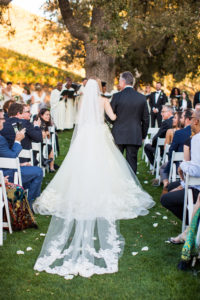 Royal Inspired Vineyard Wedding at Triunfo Creek Vineyards, bride with long veil as train