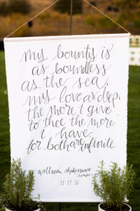 Royal Inspired Vineyard Wedding at Triunfo Creek Vineyards, Shakespeare quote on banner