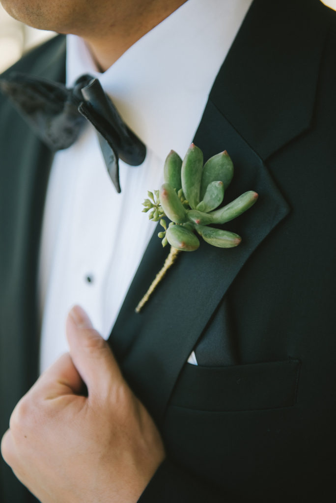 Wedding at the Ace Hotel in Palm Springs, groom getting ready, black tux with succulent boutonniere for a desert wedding