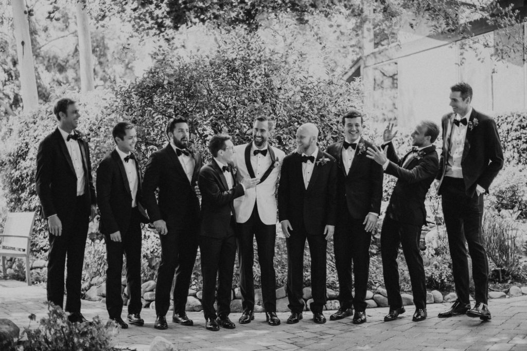 Maravilla Gardens Wedding, groom in white tuxedo jacket, groomsmen in black tuxedos