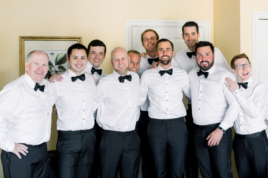 Maravilla Gardens Wedding, groomsmen getting ready with black bowties and suits from black tux