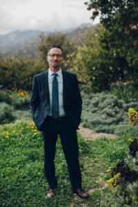 A desert wedding in Ojai at Red Tail Ranch, groom in navy suit