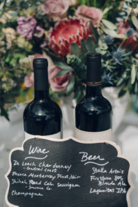 A desert wedding in Ojai at Red Tail Ranch, wine and beer chalkboard sign