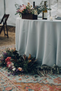 A desert wedding in Ojai at Red Tail Ranch, sweetheart table with vintage rug