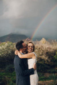 A desert wedding in Ojai at Red Tail Ranch, vintage bride and groom under a rainbow