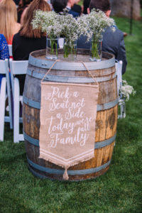 simple rustic wedding at Triunfo Creek Vineyards, wedding ceremony pick a seat sign
