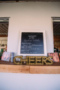 simple rustic wedding at Triunfo Creek Vineyards, wedding reception, cocktail hour marquis letters and chalkboard menu