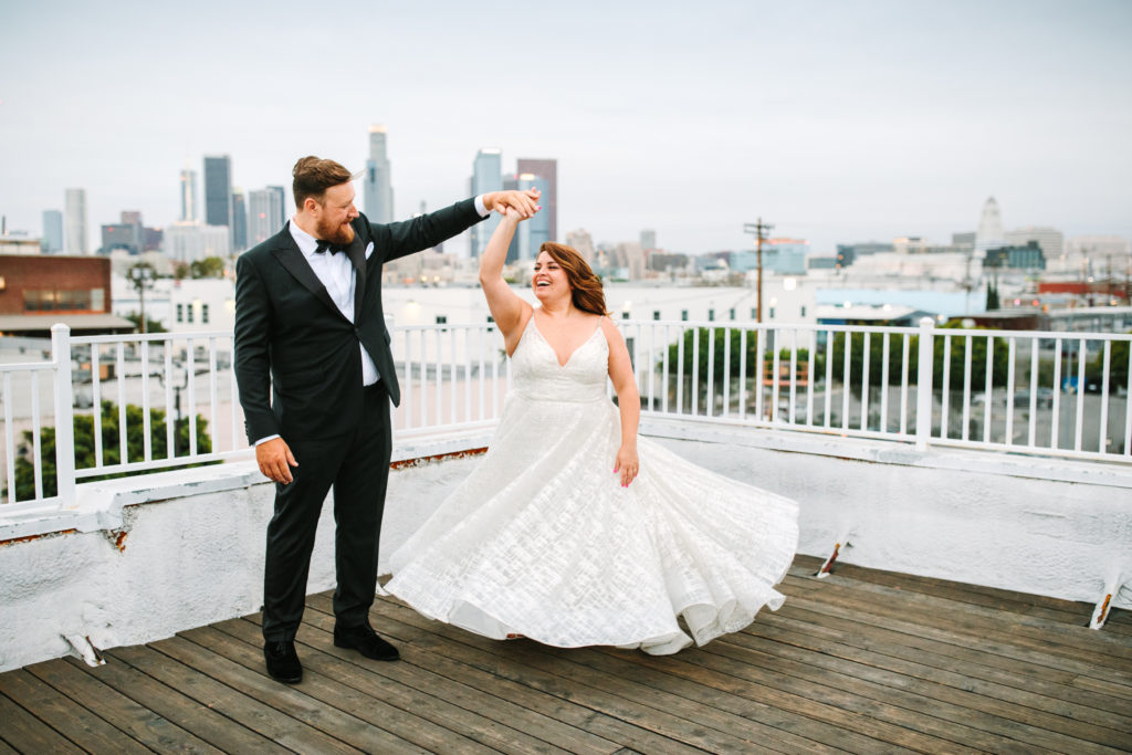 A colorful wedding at Unique Space LA, downtown skyline bride and groom portraits