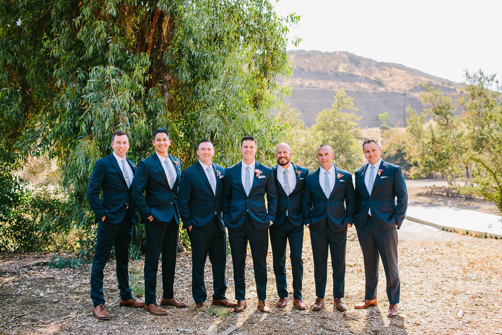 groom with groomsmen in navy blue suits at Triunfo Creek Vineyards