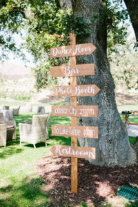 Wooden arrow direction sign for ceremony, cocktail hour and reception for Triunfo Creek Vineyards wedding