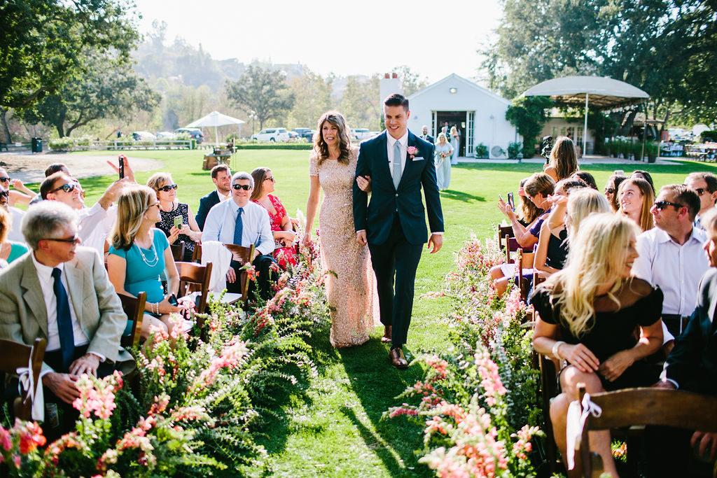 groom walking down aisle for wedding ceremony at Triunfo Creek Vineyards