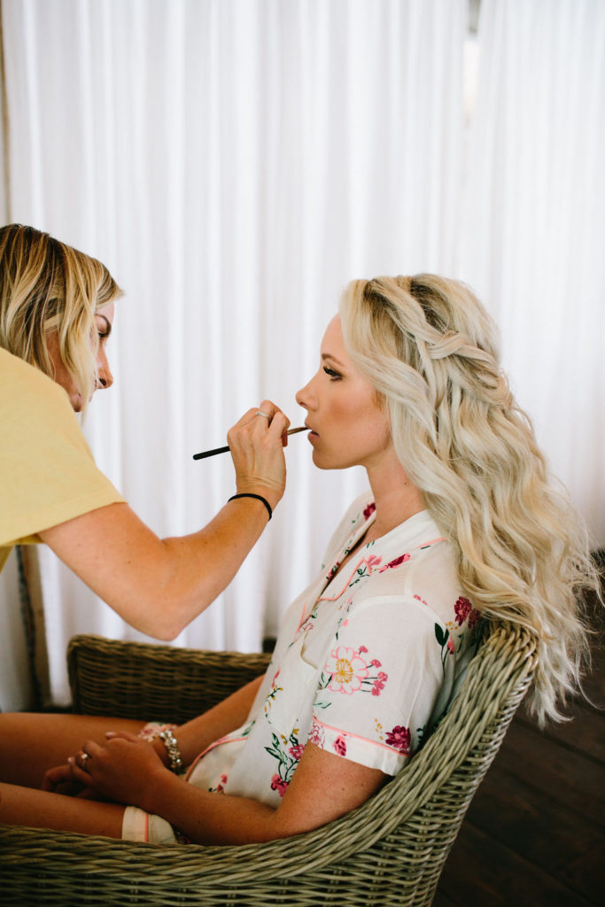 bride getting ready with hair and makeup, braided crown at Triunfo Creek Vineyards