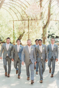 An emotional calamigos ranch wedding, groom and groomsmen in light grey suits and pale pink ties
