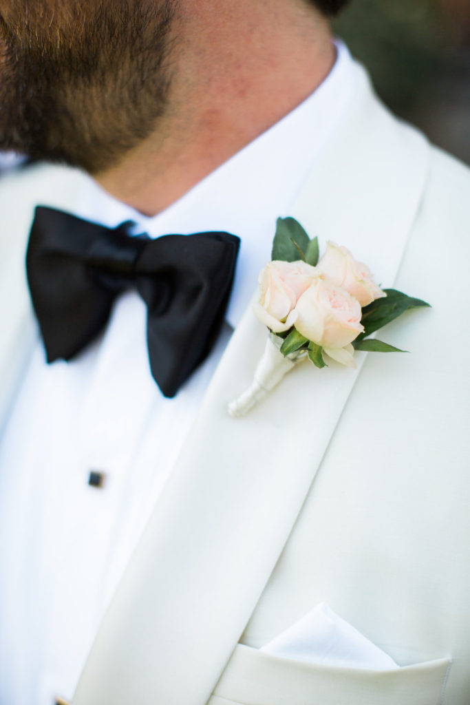 pale blush rose groom boutonniere for east coast meets west coast wedding at Calamigos Ranch