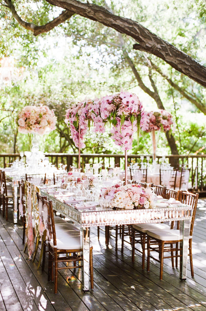 east coast meets west coast wedding reception at Calamigos Ranch with pink orchid centerpiece
