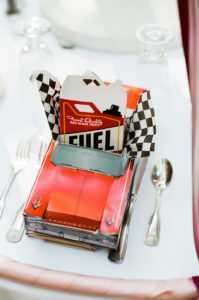 east coast meets west coast wedding reception with car placemats for kids table