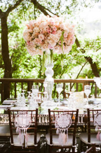 east coast meets west coast wedding reception at Calamigos Ranch with pale pink floral centerpieces