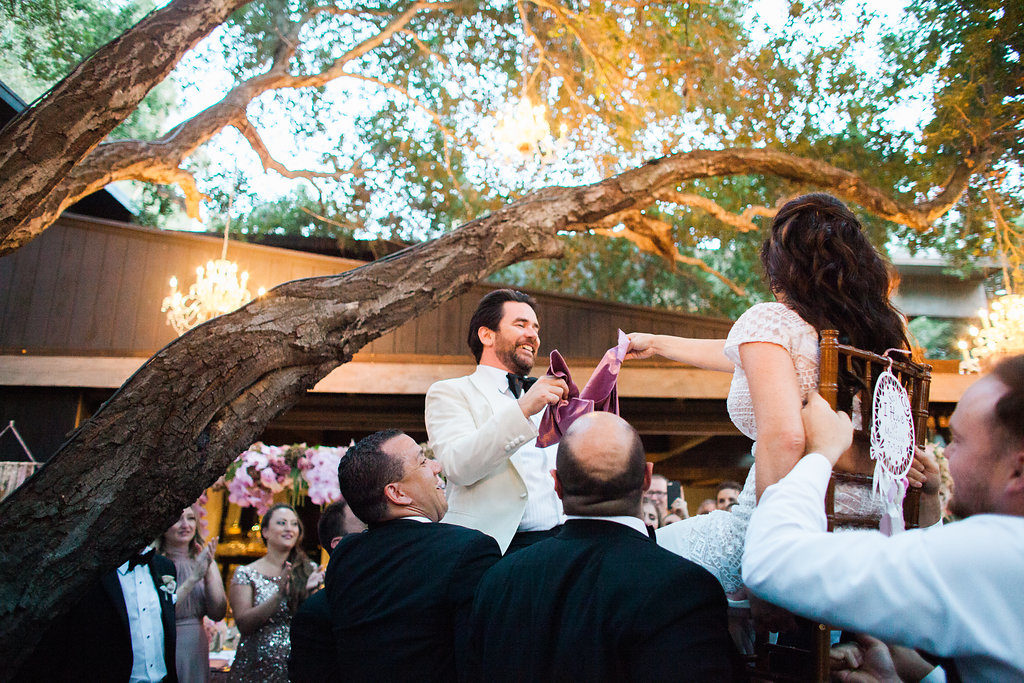Jewish bride and groom hora dance at wedding reception at Calamigos Ranch
