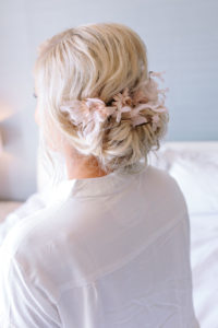 A glam and California infused wedding at Viceroy Santa Monica, bridal updo with blush pink flowers