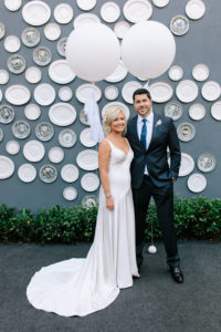 A glam and California infused wedding at Viceroy Santa Monica, bride and groom portrait shot with white balloons