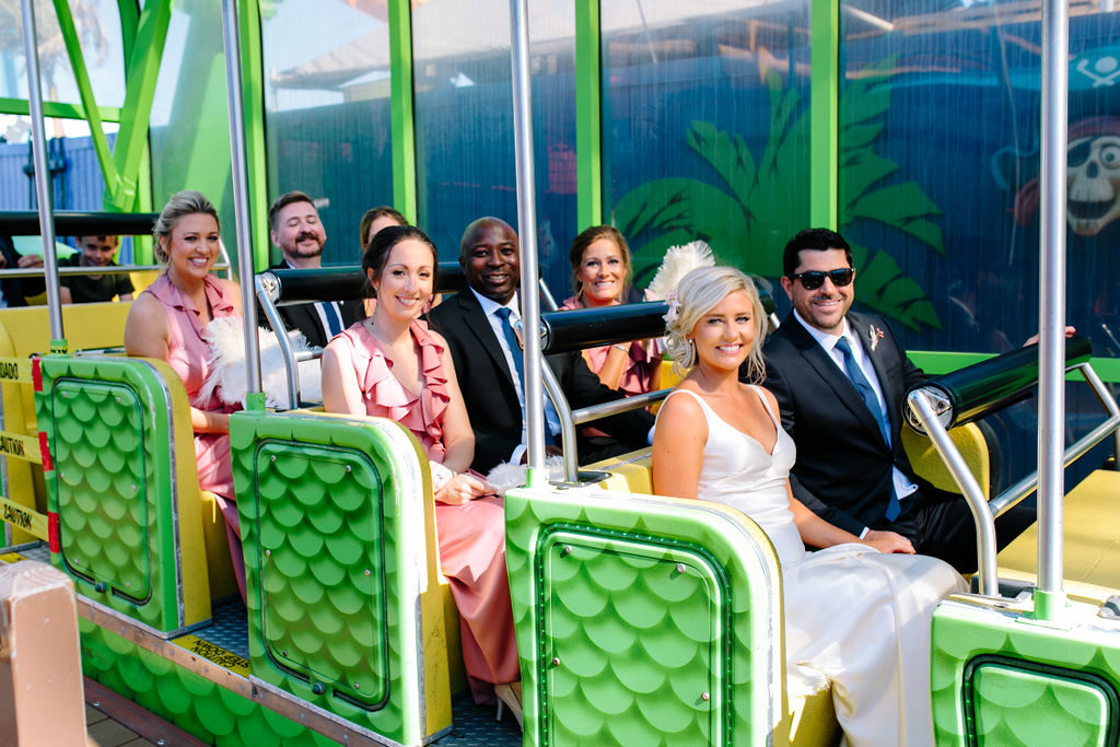A glam and California infused wedding at Viceroy Santa Monica, bride and groom at Santa Monica pier riding rollercoaster