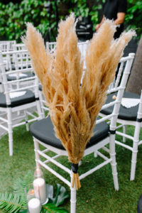 A glam and California infused wedding ceremony at Viceroy Santa Monica with pampas grass