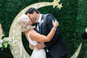 A glam and California infused wedding ceremony at Viceroy Santa Monica, bride and groom first kiss