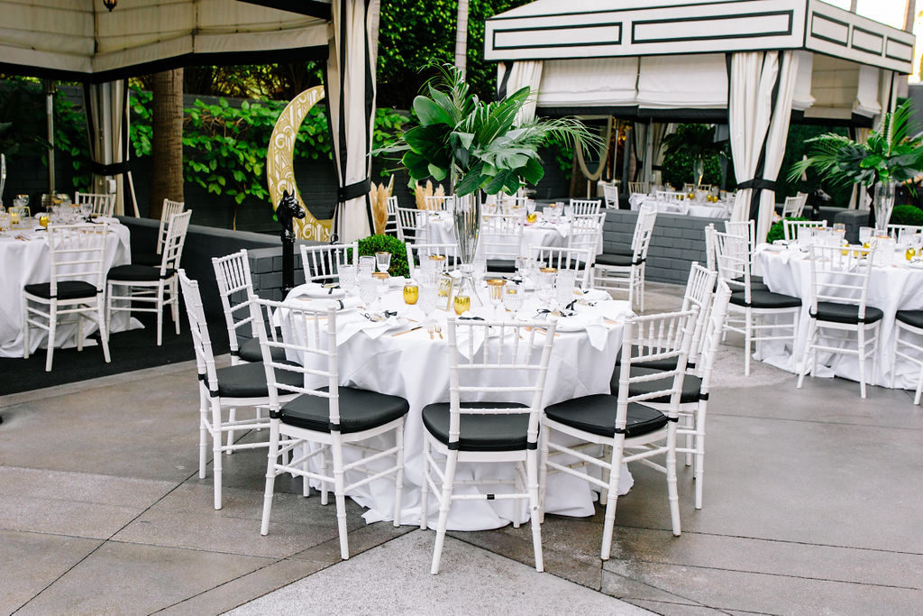 A glam and California infused wedding ceremony at Viceroy Santa Monica, black and white table setting