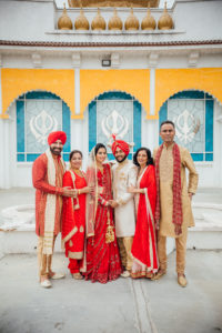 Stunning Indian Wedding in San Pedro, red bridal sari and groom in gold sherwani for sikh ceremony, bride and groom portrait