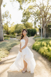bridal portrait shot wearing modern hi-low wedding dress at this contemporary wedding at the Natural History Museum in Los Angeles