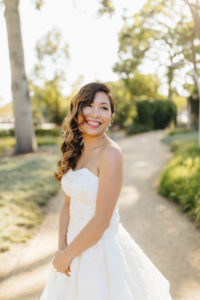 Bride portrait shot with loose curls at this contemporary wedding at the Natural History Museum in Los Angeles