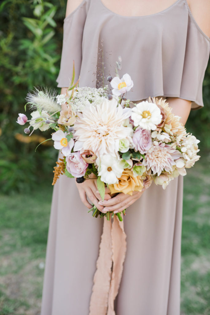 A chic rustic wedding at Calamigos Ranch, bridesmaid bouquet with dahlias and wildflowers