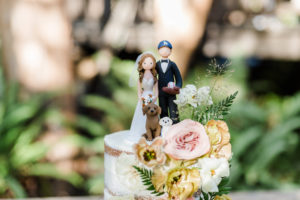 A chic rustic wedding at Calamigos Ranch, wooden bride and groom cake topper