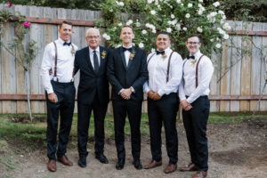 A chic rustic wedding at Calamigos Ranch, groom and groomsmen in suspenders