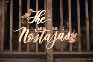 A chic rustic wedding at Calamigos Ranch, laser cut wooden name sign