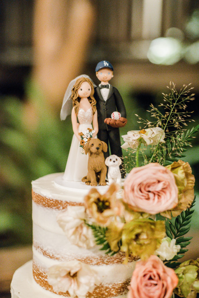 A chic rustic wedding at Calamigos Ranch, bride and groom cake cutting