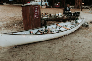 Summer camp themed wedding reception in Big Bear at Camp Wasegan, booze canoe