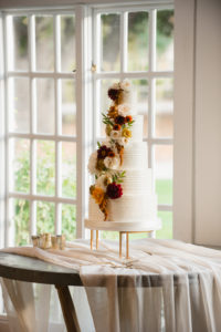 A simple and modern wedding ceremony at Triunfo Creek Vineyards, cake with yellow flowers