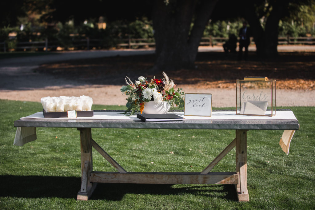 A simple and modern wedding ceremony at Triunfo Creek Vineyards, welcome table