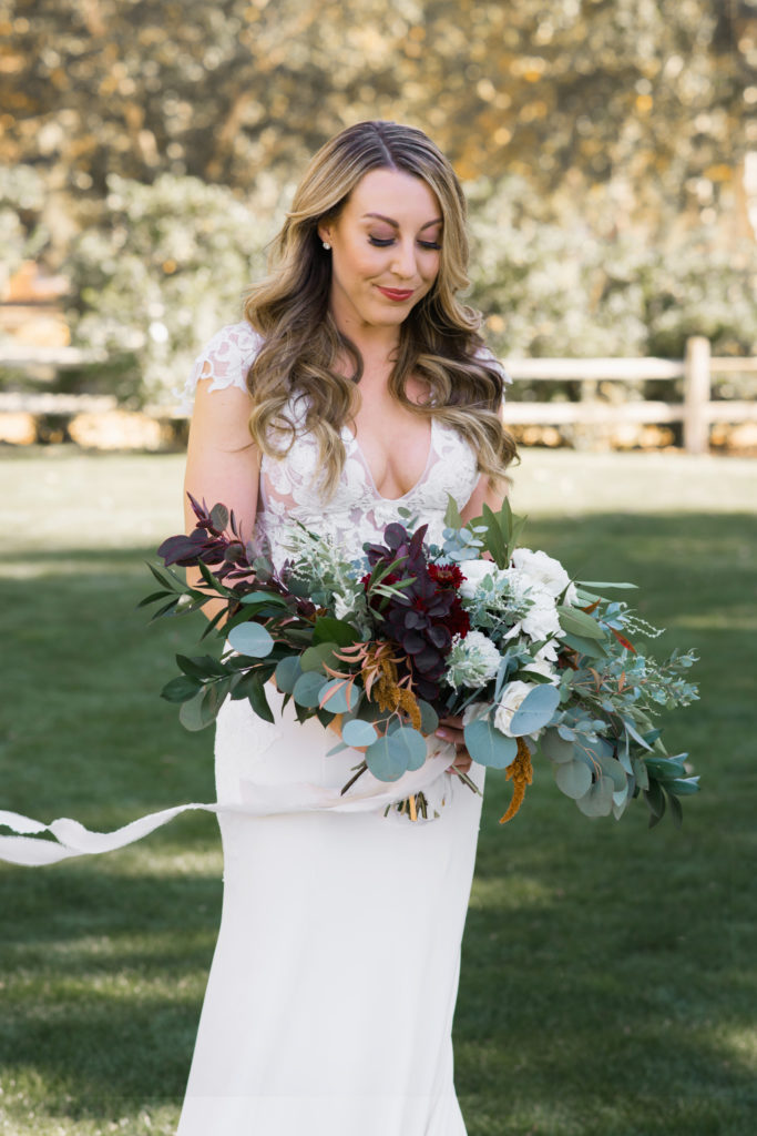A simple and modern wedding at Triunfo Creek Vineyards, bridal bouquet with eucalyptus and maroon and white flowers
