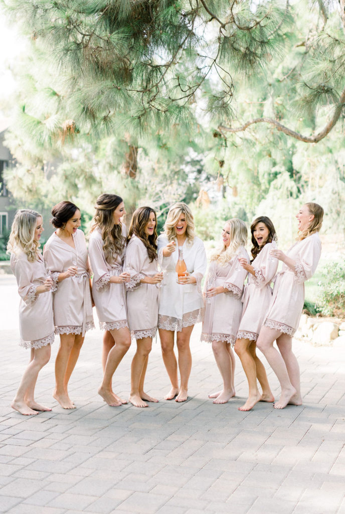 A Romantic Fall Wedding at Maravilla Gardens, bride getting ready with bridesmaids in matching robes