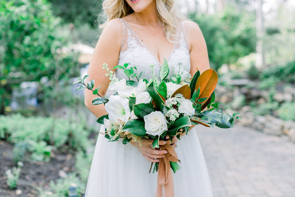 A Romantic Fall Wedding at Maravilla Gardens, bridal bouquet with magnolia leaves