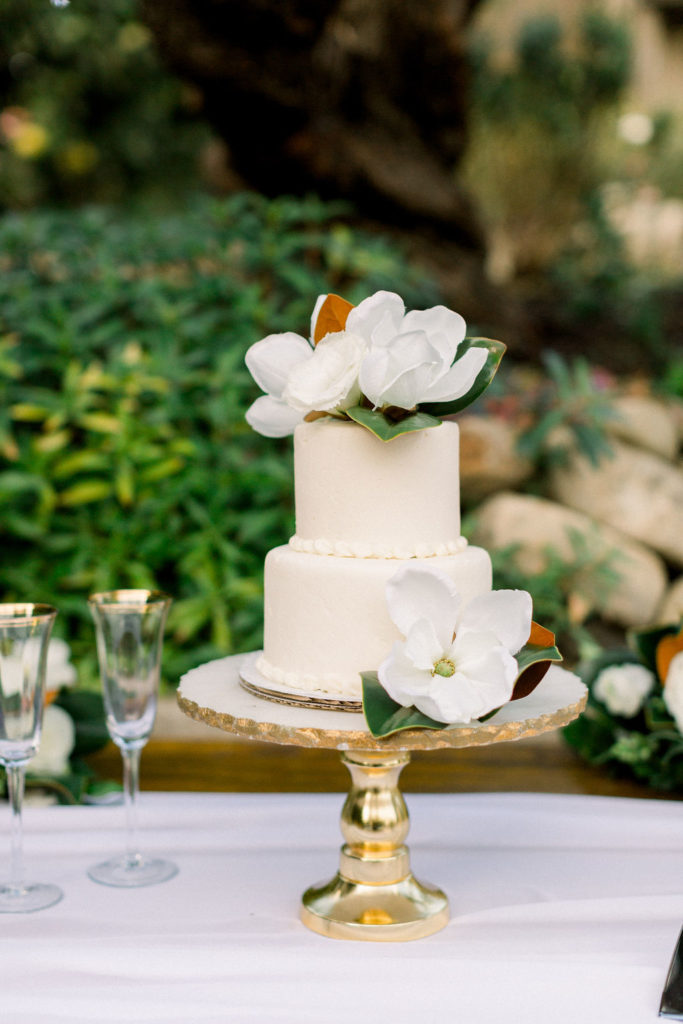 A Romantic Fall Wedding reception at Maravilla Gardens, small wedding cake with magnolia leaves