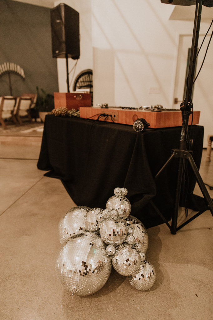 A Joshua Tree wedding reception at Tumbleweed Sanctuary, Studio 54 inspired wedding with disco balls