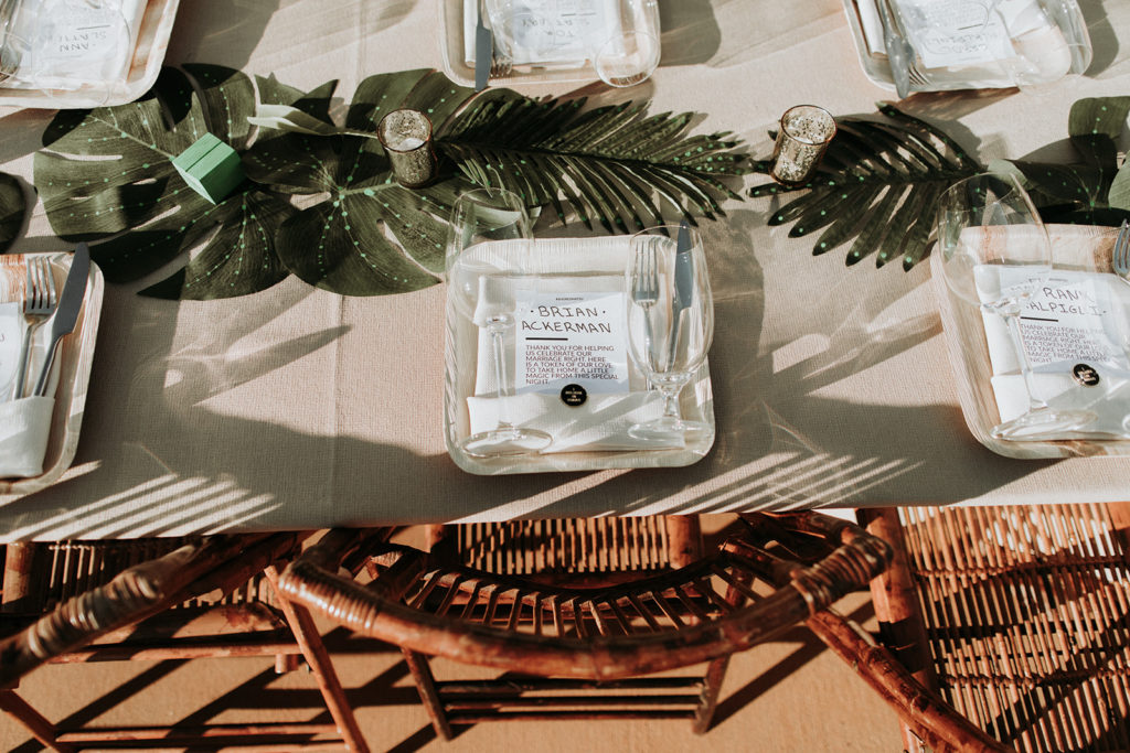 A Joshua Tree wedding at Tumbleweed Sanctuary, reception tables with monstera leaf centerpieces 