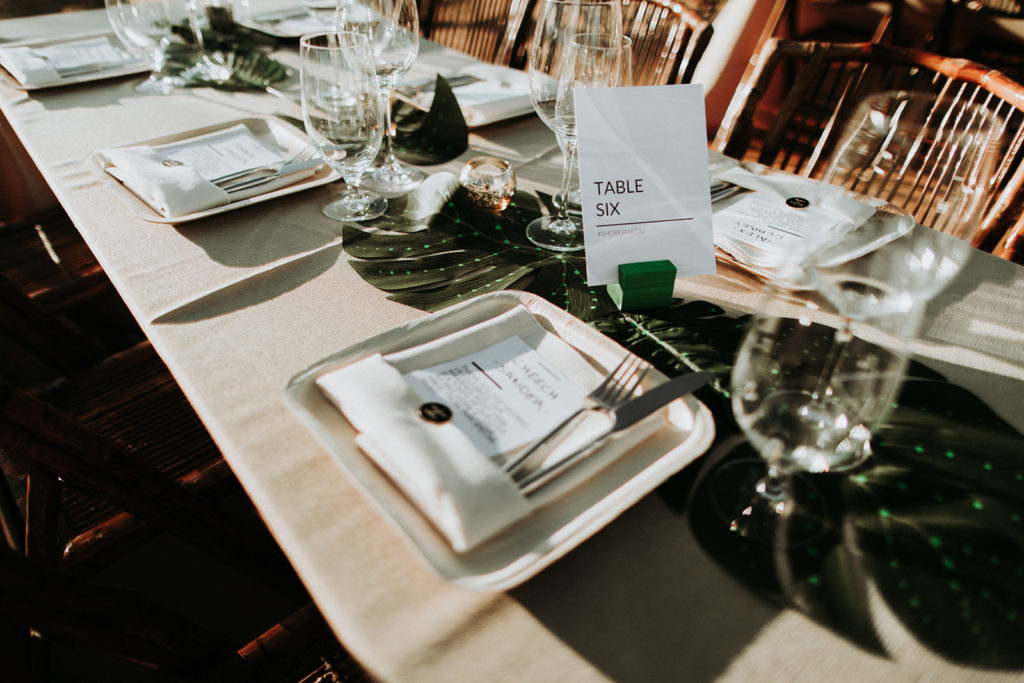 A Joshua Tree wedding at Tumbleweed Sanctuary, reception tables with monstera leaves