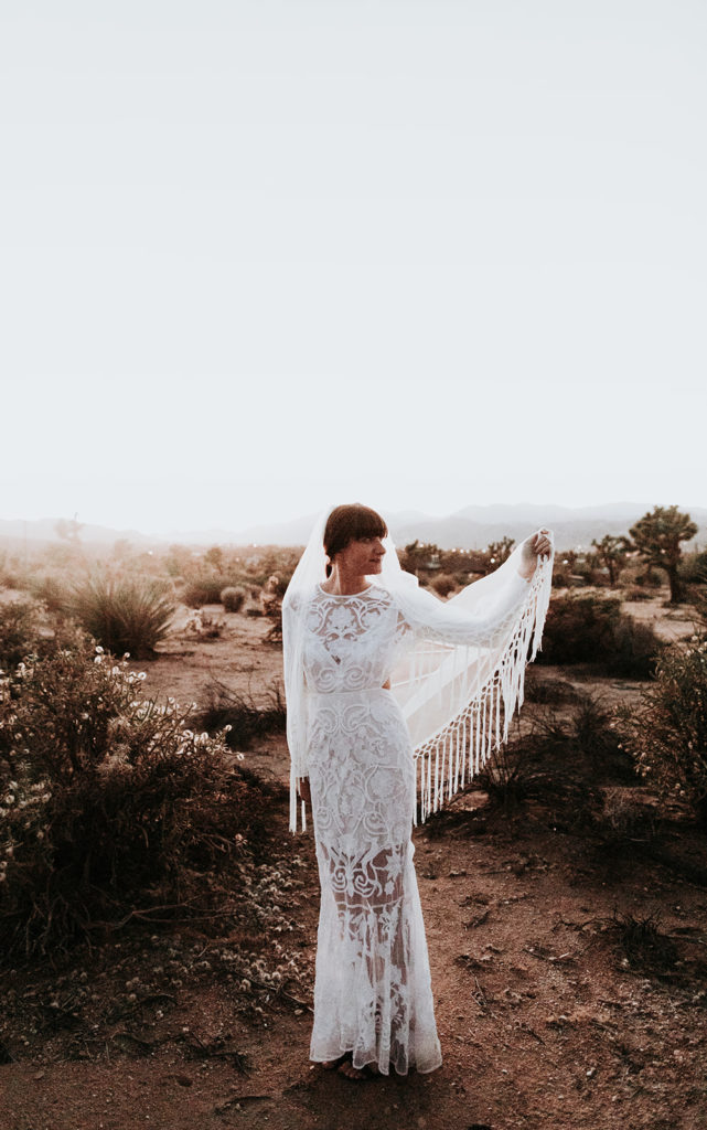 A Joshua Tree wedding at Tumbleweed Sanctuary, bride and groom sunset portrait shots in the desert, bohemian bride veil