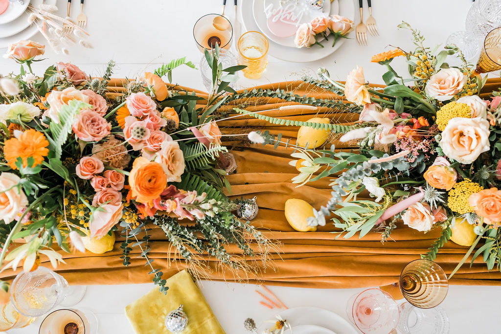 Spring Fever inspired styled shoot at La Piñata + Feathered Arrow Events using orange, pink and yellow in your wedding, wildflower centerpiece